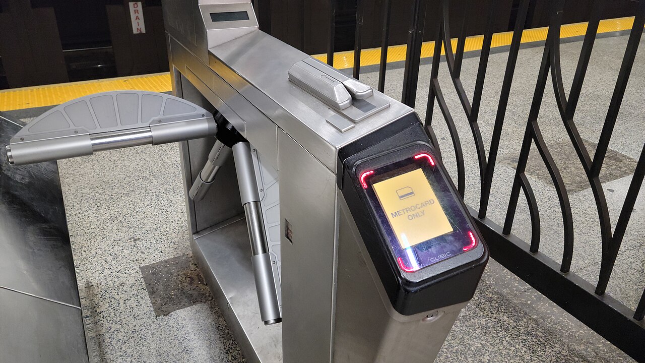 Outside fare control in the southern fare control area at the south end of the Uptown platform of the 49th Street BMT Broadway Line station, under TSX Broadway (1568 Broadway) and the Palace Theater a